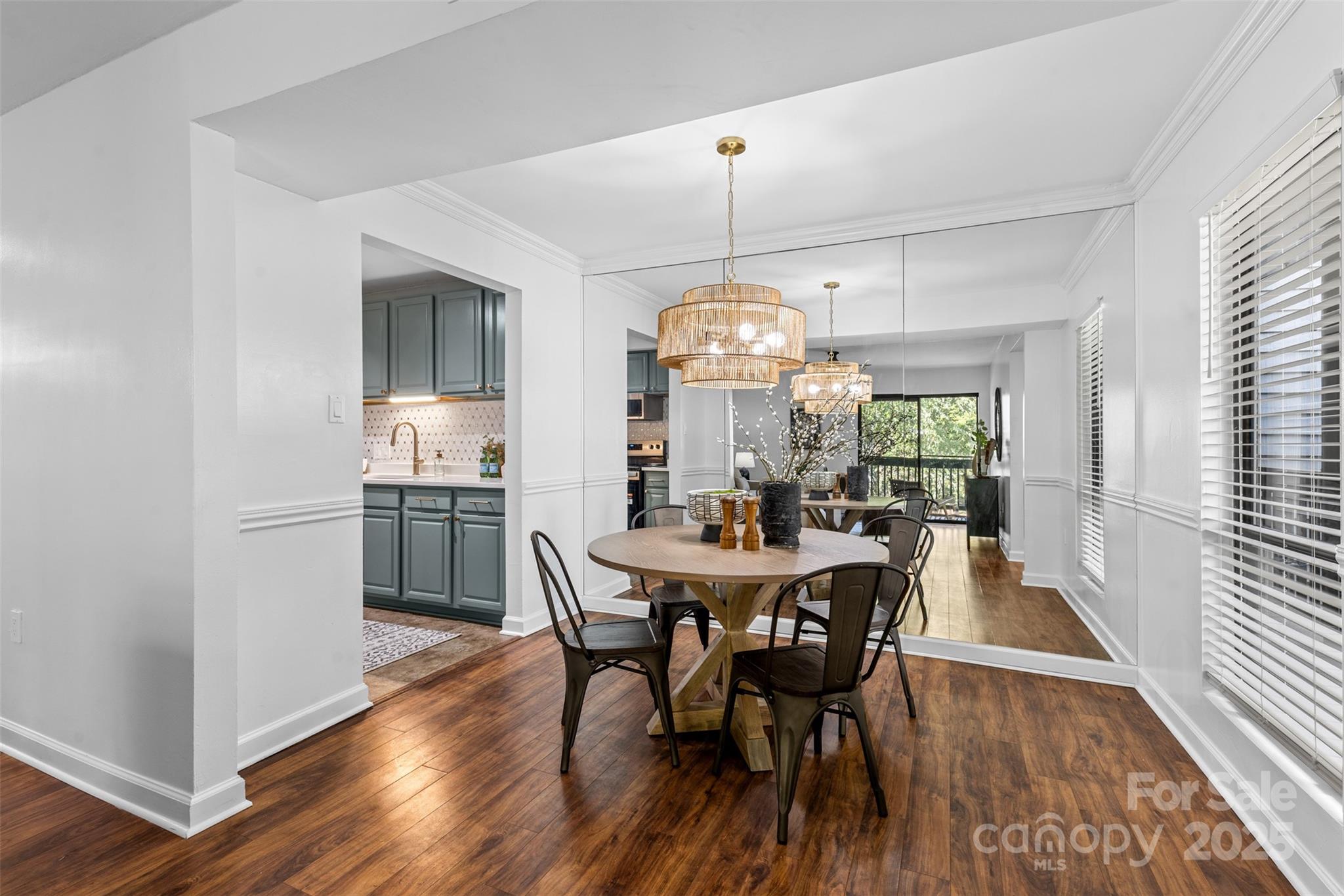 5016 Sardis Road, Unit G Charlotte, NC 28270 - Photo 5 of 24 a view of a dining room with furniture window and wooden floor