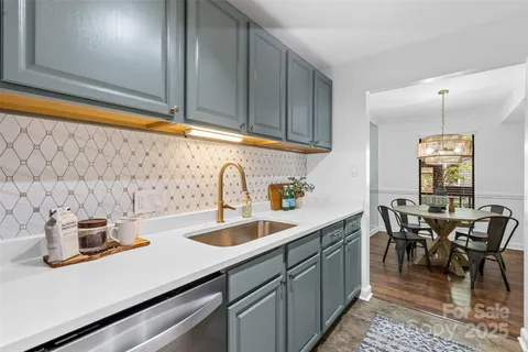 a kitchen with sink and cabinets