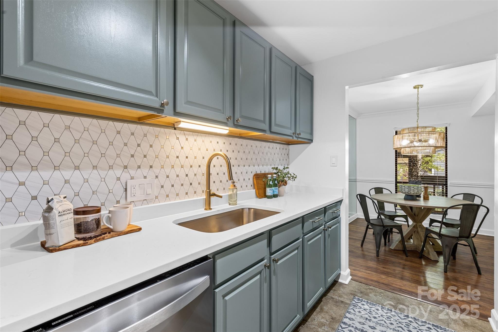 5016 Sardis Road, Unit G Charlotte, NC 28270 - Photo 9 of 24 a kitchen with sink and cabinets