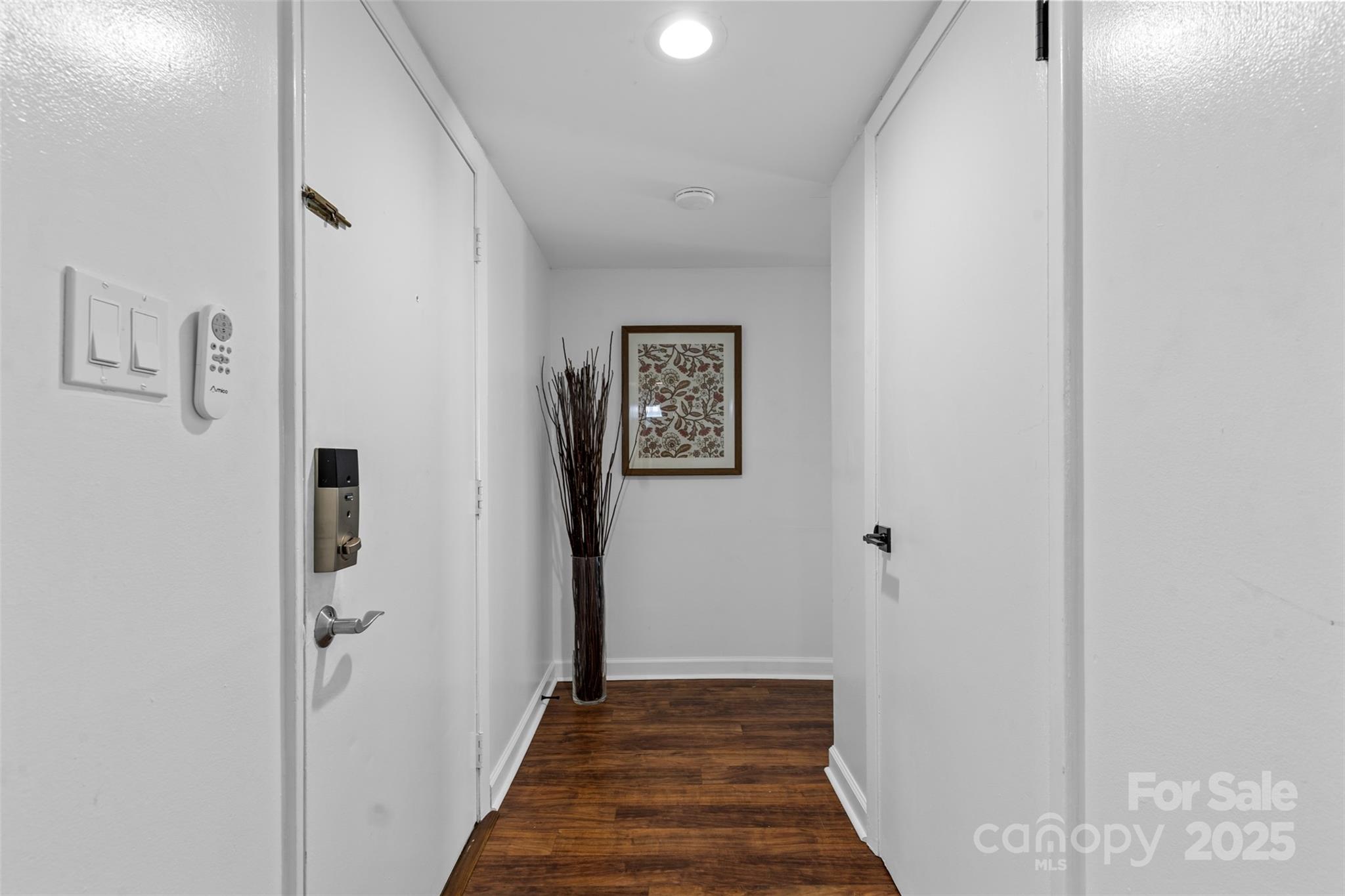 5016 Sardis Road, Unit G Charlotte, NC 28270 - Photo 10 of 24 a view of a hallway with wooden floor and closet