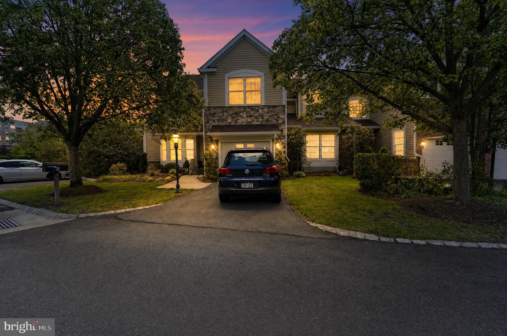 6 Hedge Row Road Princeton, NJ 08540 - Photo 1 of 32 a car parked in front of a house next to a yard