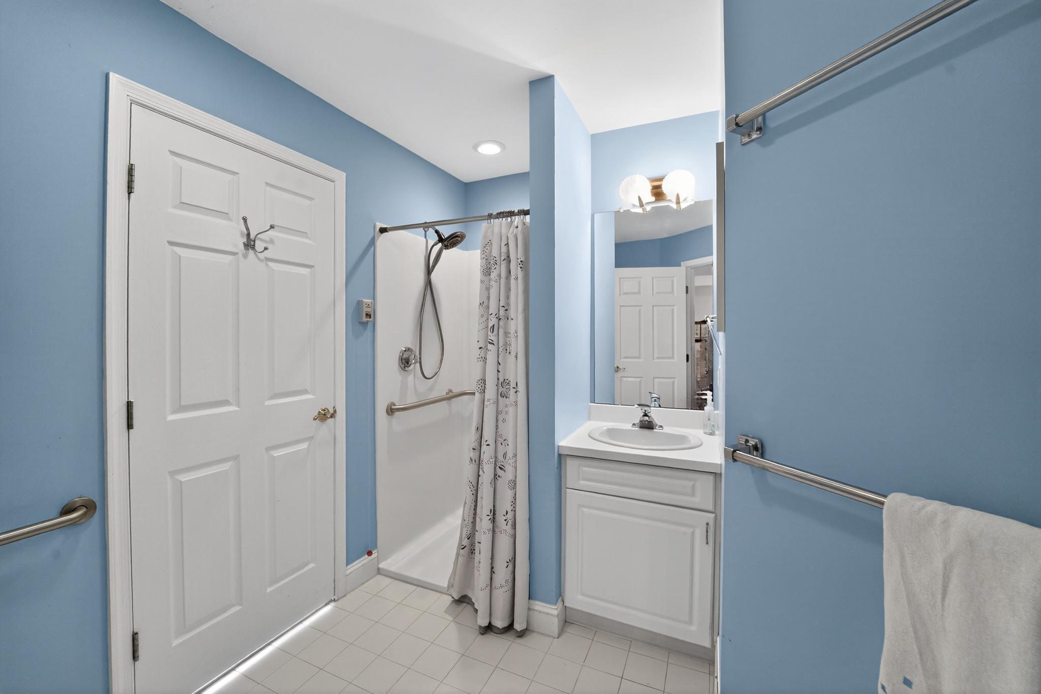 6 Hedge Row Road Princeton, NJ 08540 - Photo 23 of 32 a bathroom with a sink a tub and a mirror