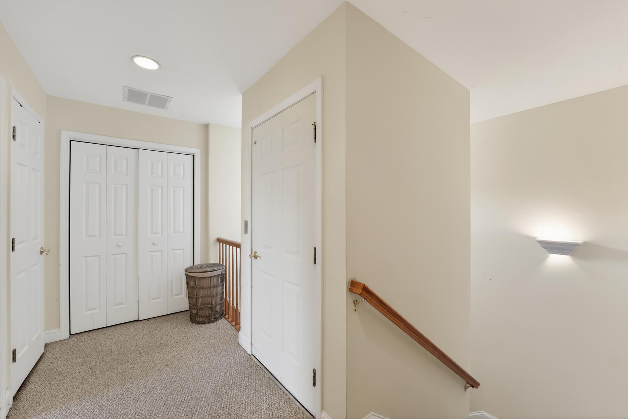6 Hedge Row Road Princeton, NJ 08540 - Photo 24 of 32 a view of a hallway with closet and a bathroom