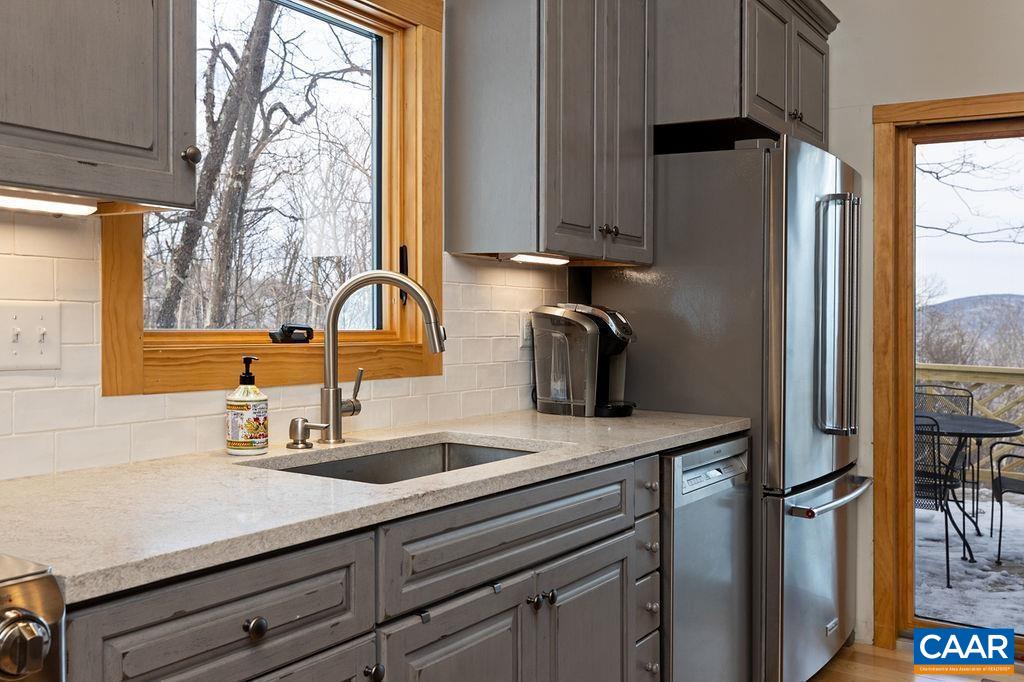 134 Squirrel Tree Lane Roseland, VA 22967 - Photo 16 of 40 a kitchen with a refrigerator and a sink