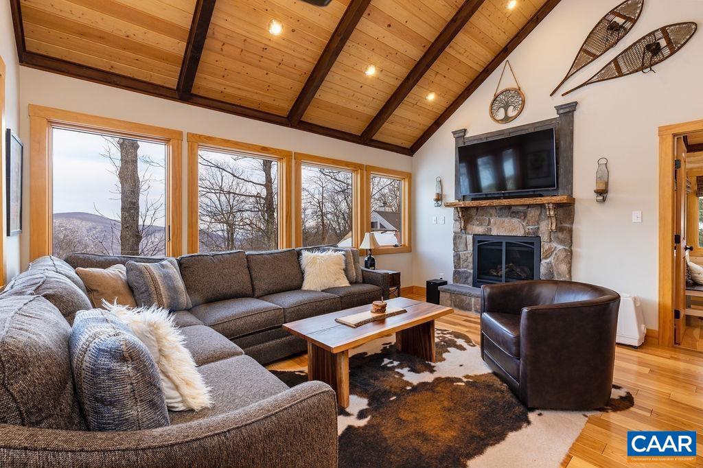 134 Squirrel Tree Lane Roseland, VA 22967 - Photo 19 of 40 a living room with furniture fireplace and a flat screen tv