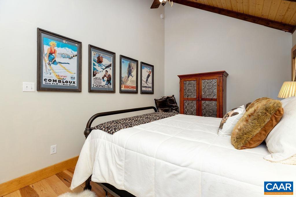 134 Squirrel Tree Lane Roseland, VA 22967 - Photo 23 of 40 a bedroom with a bed and painting on the wall