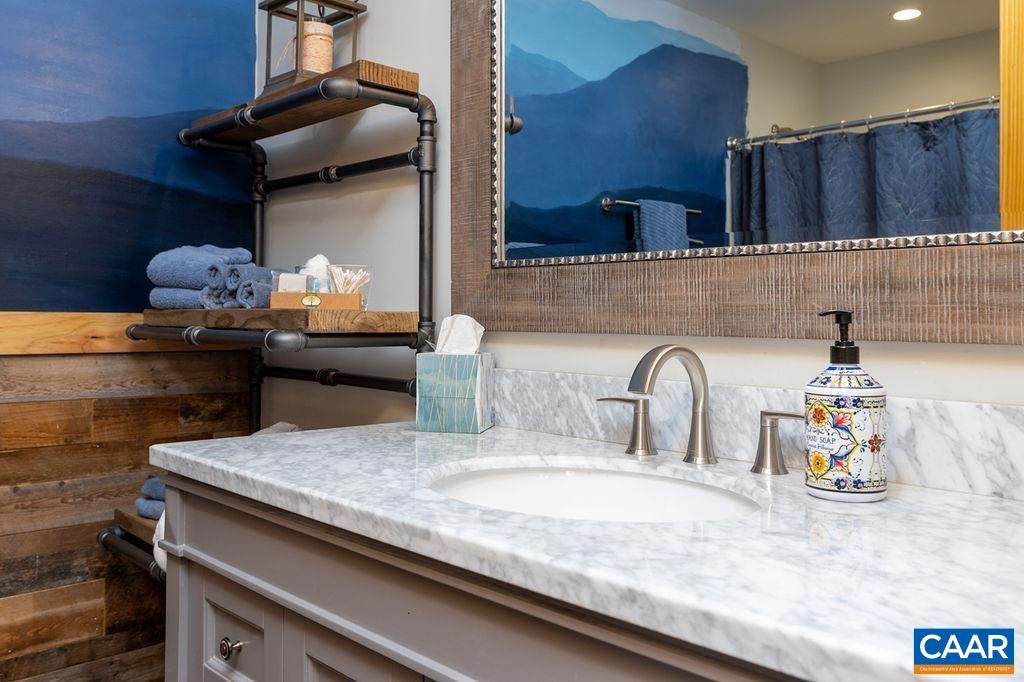 134 Squirrel Tree Lane Roseland, VA 22967 - Photo 24 of 40 a kitchen with a sink and a stove with wooden floor