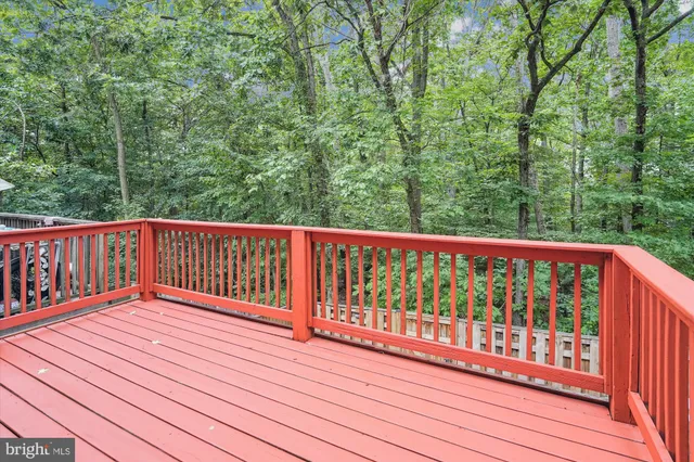 a view of balcony with wooden floor