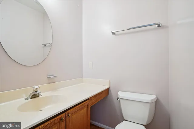 a bathroom with a sink toilet and vanity