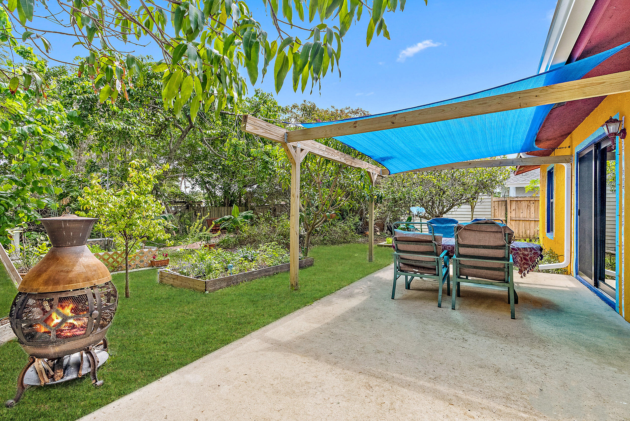 154 Chapel Lane Tequesta, FL 33469 - Photo 23 of 28 a chairs and a table in the garden