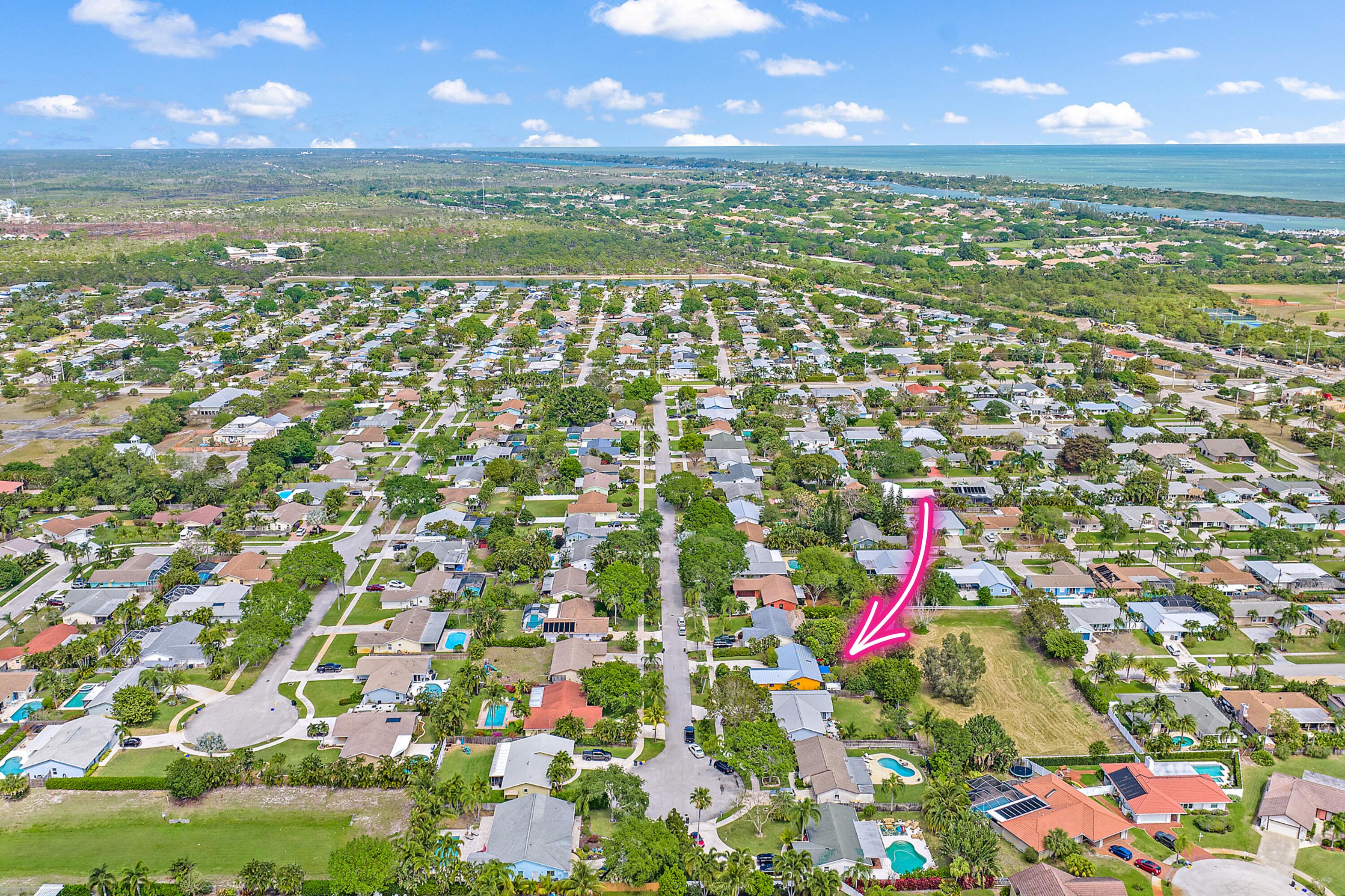 154 Chapel Lane Tequesta, FL 33469 - Photo 28 of 28 a view of swimming pool from a city