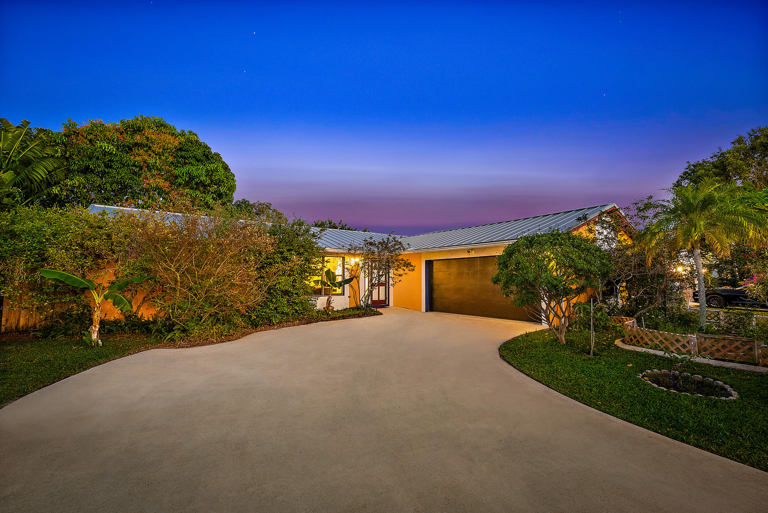 154 Chapel Lane Tequesta, FL 33469 - Photo 4 of 28 a view of a road with a building in the background