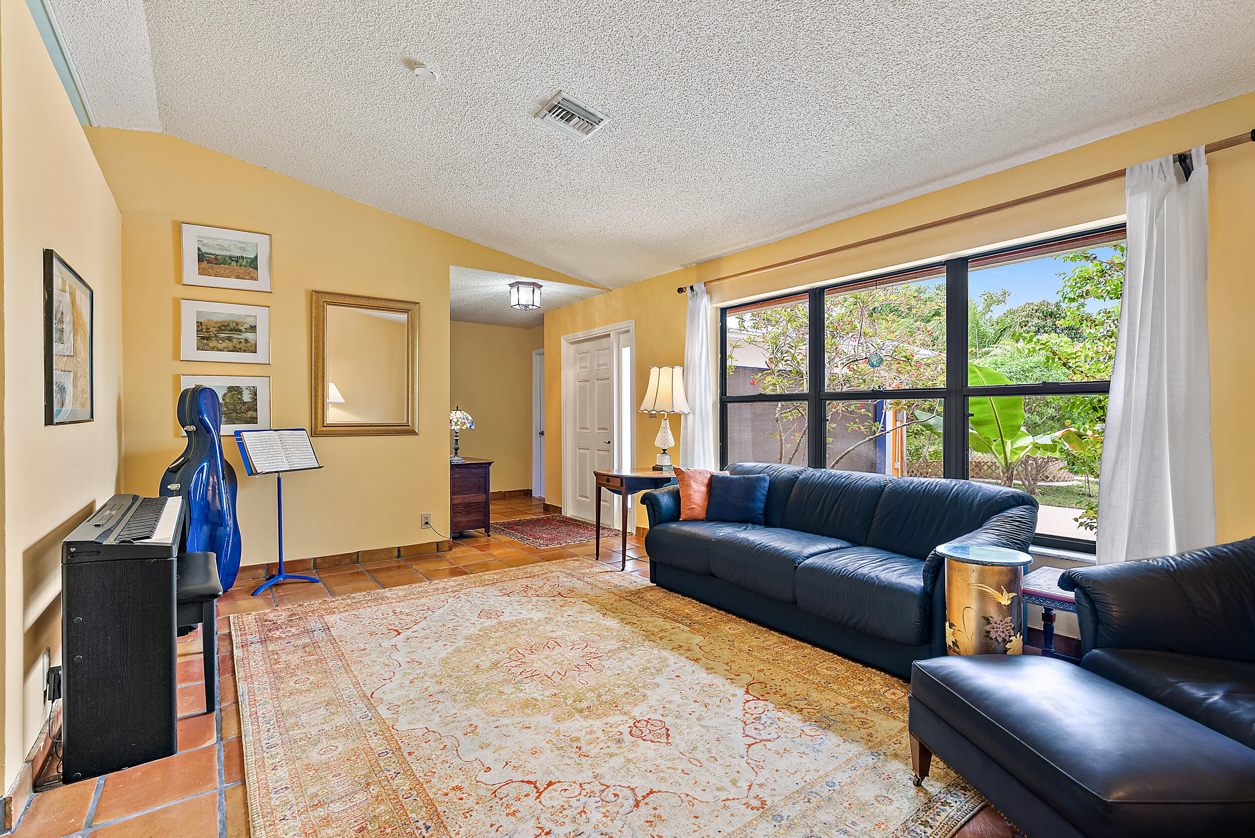 154 Chapel Lane Tequesta, FL 33469 - Photo 5 of 28 a living room with furniture and a flat screen tv
