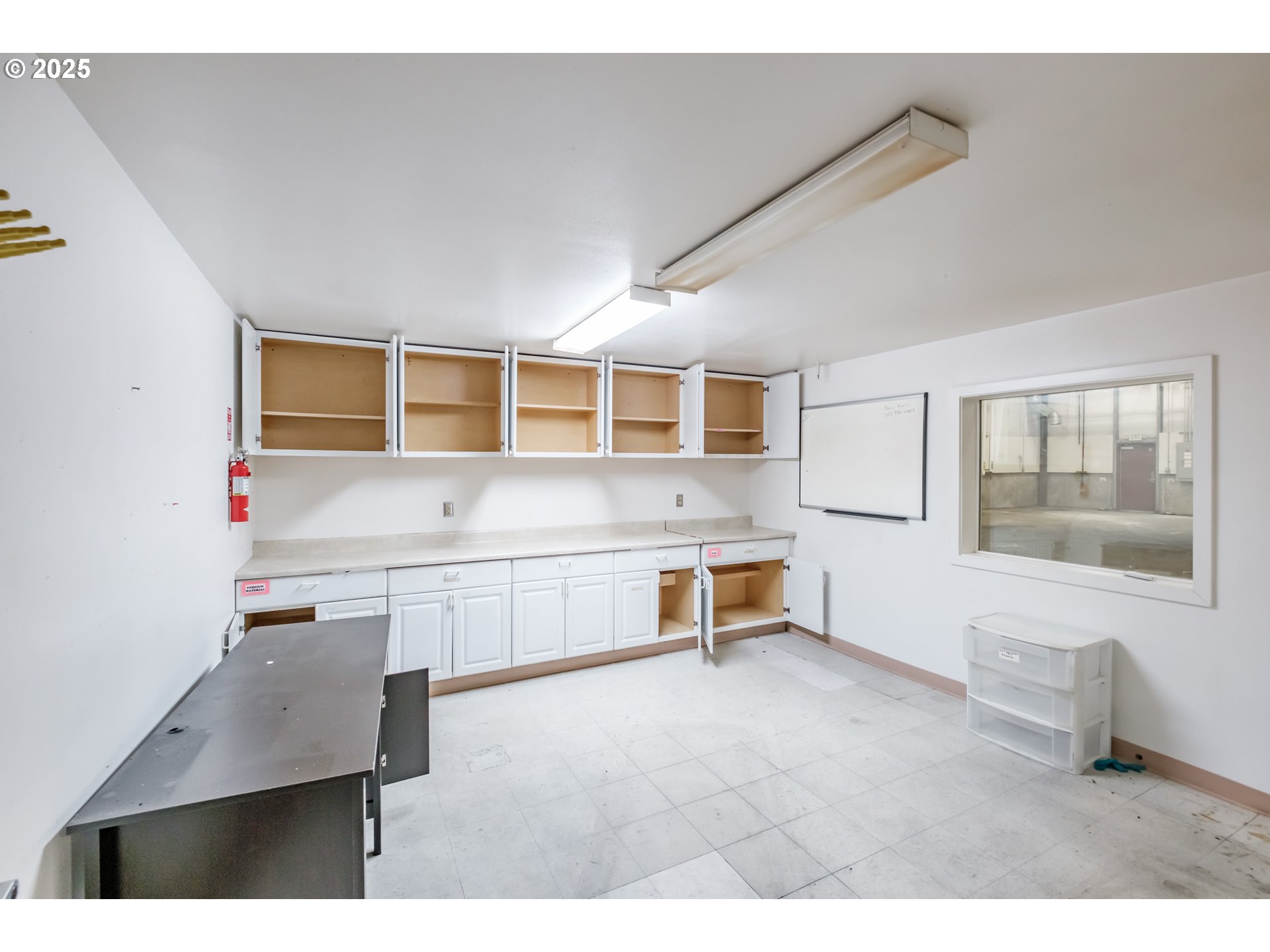 595 North Fir Villa Road Dallas, OR 97338 - Photo 20 of 37 a kitchen with a refrigerator and wooden cabinets