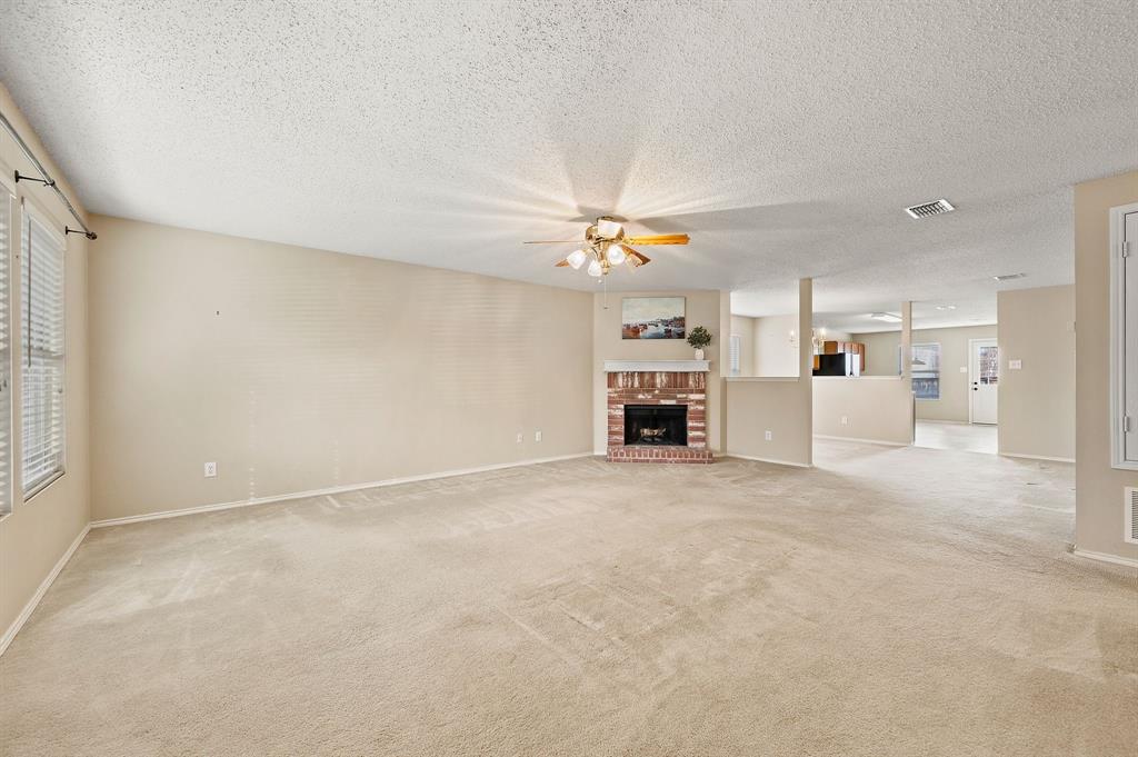 5308 Temecula Road Fort Worth, TX 76244 - Photo 11 of 37 a view of a livingroom with furniture and a ceiling fan