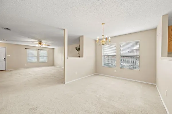 a kitchen with stainless steel appliances granite countertop a refrigerator stove top oven a sink and dishwasher