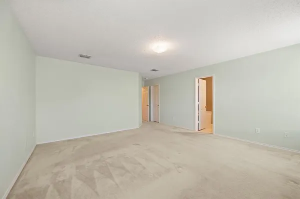 a bathroom with a double vanity sink mirror and toilet
