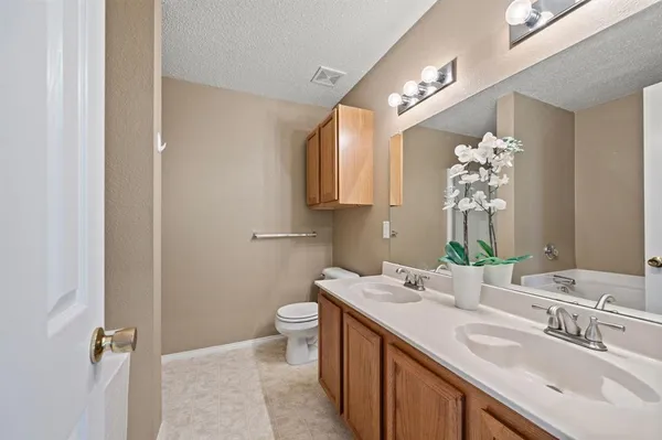 a bathroom with a bathtub and a sink