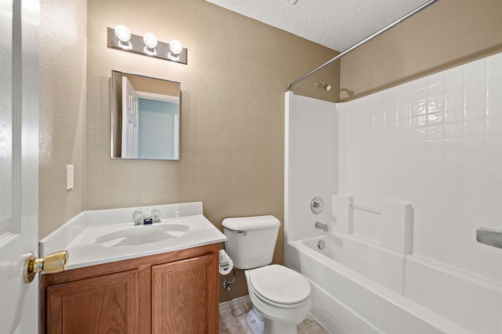 5308 Temecula Road Fort Worth, TX 76244 - Photo 27 of 37 a bathroom with a sink a toilet and shower