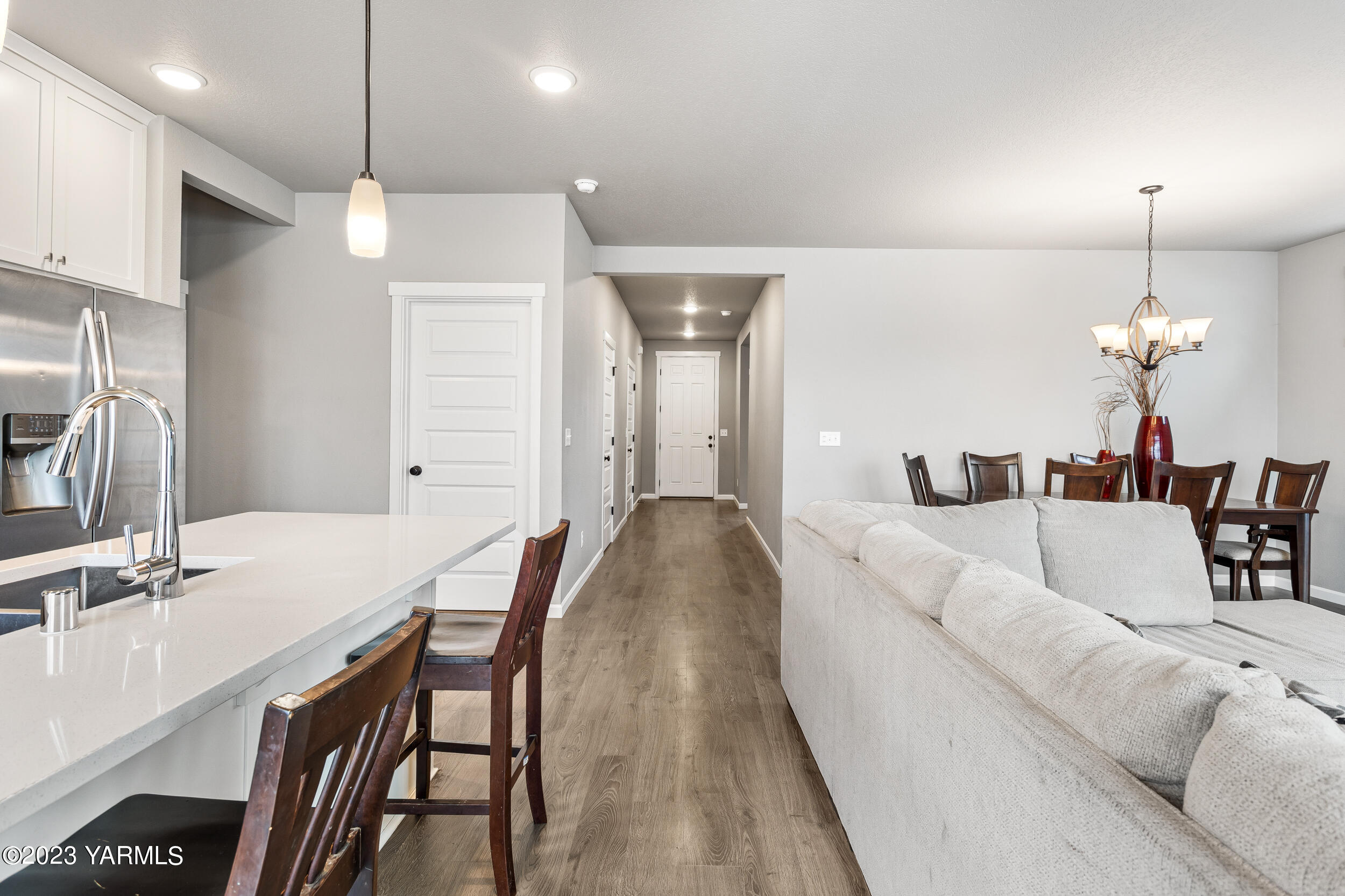 2203 Ekelman Road Yakima, WA 98901 - Photo 9 of 16 a living room with furniture a sink and a chandelier