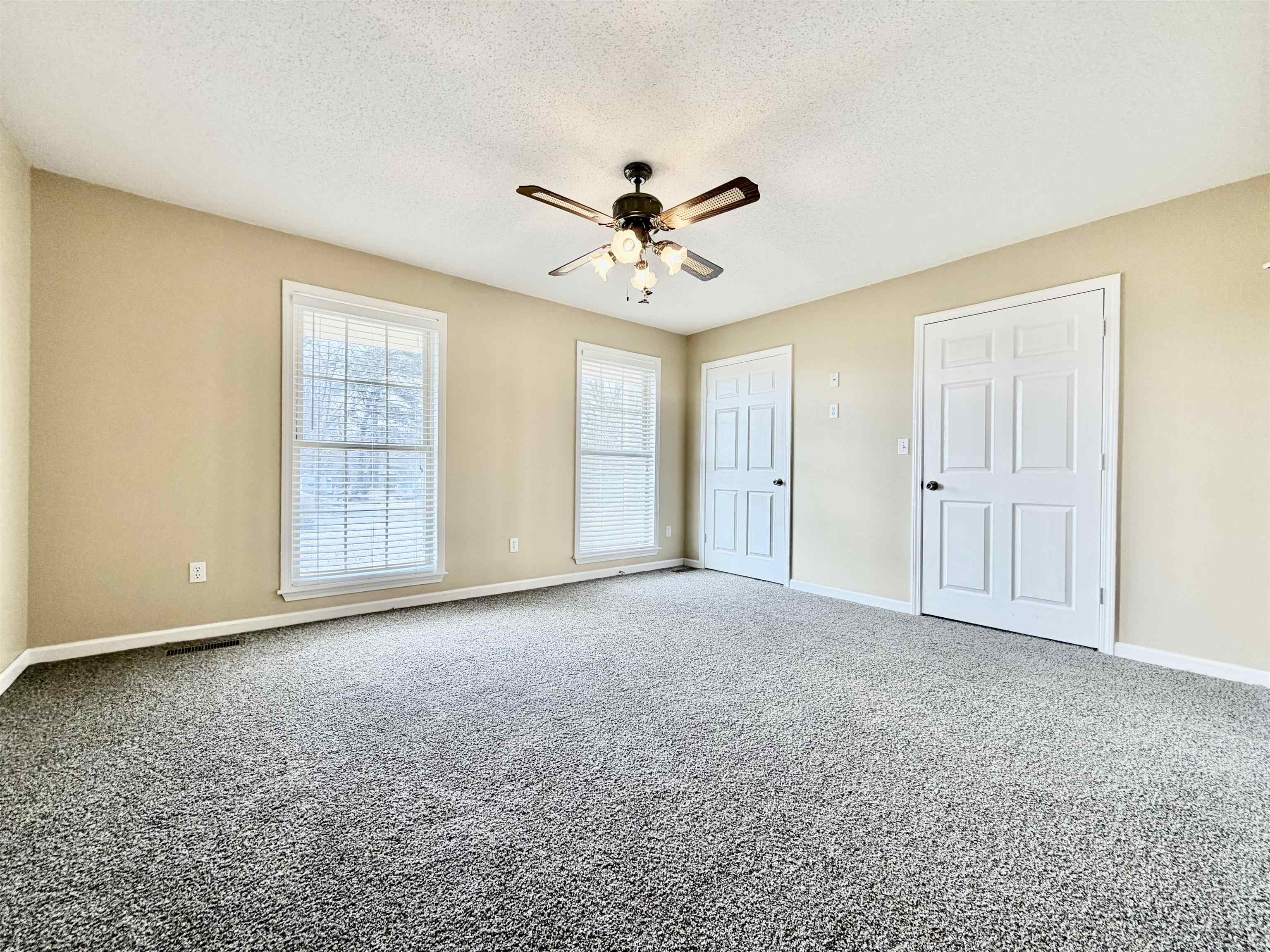 1086 Sloan Road Burlison, TN 38015 - Photo 20 of 24 Unfurnished bedroom featuring carpet, a textured ceiling, and ceiling fan