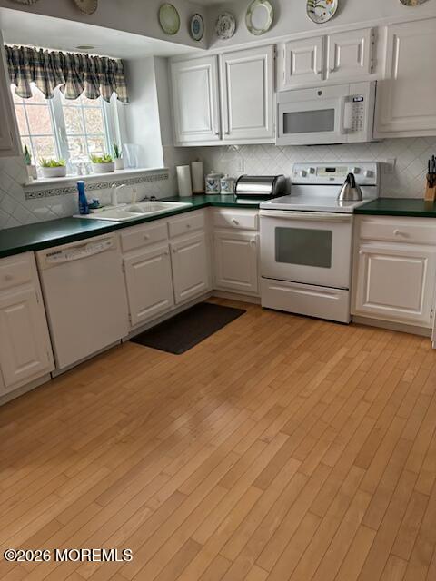 16 Cherry Court Spring Lake Heights, NJ 07762 - Photo 3 of 15 a kitchen with stainless steel appliances granite countertop a stove a sink and white cabinets
