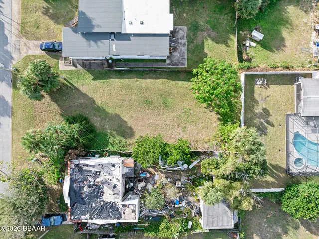 an aerial view of a house with a garden