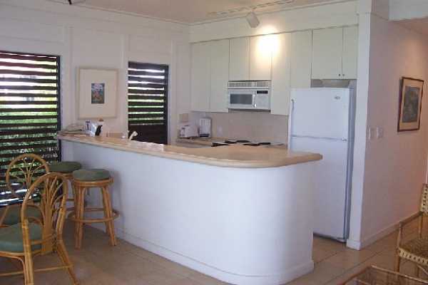 2253 Poipu Road, Unit 28 Koloa, HI 96756 - Photo 1 of 12 a room with chairs and window