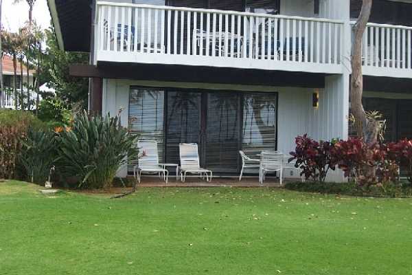 2253 Poipu Road, Unit 28 Koloa, HI 96756 - Photo 12 of 12 a view of a chair and table in back yard of the house