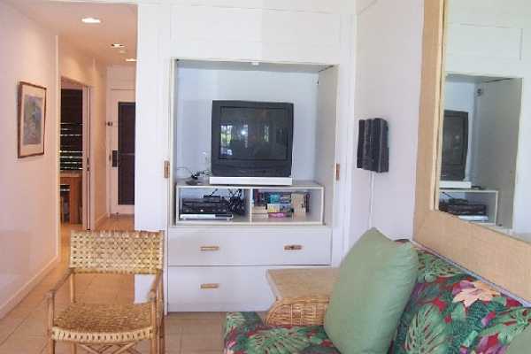 2253 Poipu Road, Unit 28 Koloa, HI 96756 - Photo 6 of 12 a living room with furniture and a flat screen tv