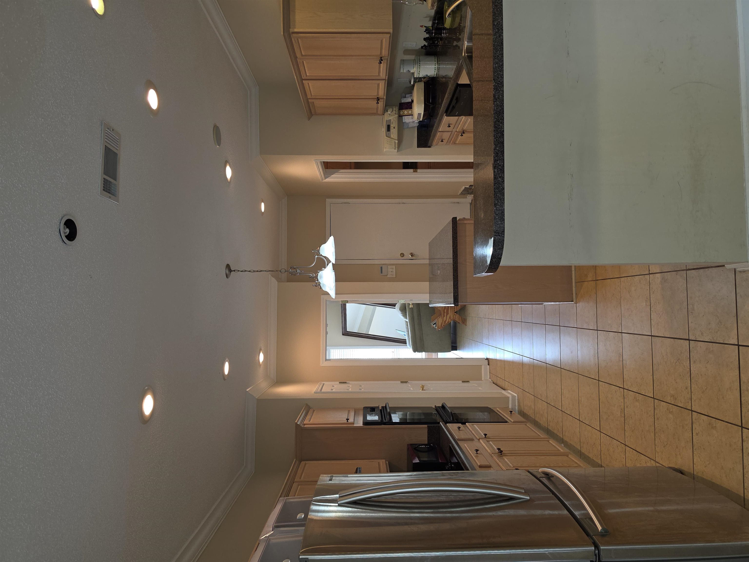 7253 Rourke Circle Memphis, TN 38125 - Photo 6 of 31 Kitchen featuring stainless steel appliances, light wood cabinetry, recessed lighting, and a tile floor