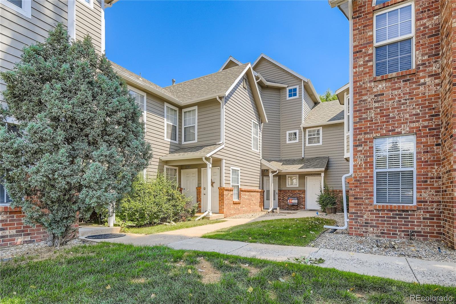 2129 Troy Court Colorado Springs, CO 80918 - Photo 1 of 27 front view of a house with a yard