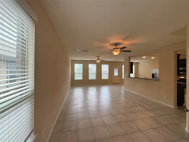 a view of a hallway with a kitchen