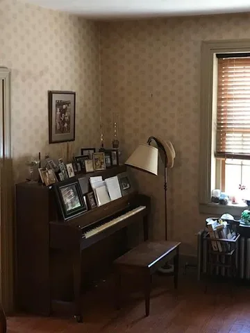 a bed room with a bed and a chair