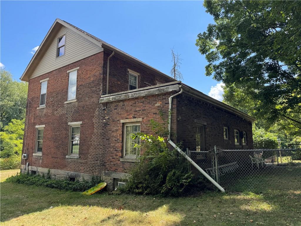 828 Brownhome Road New Castle, PA 16101 - Photo 5 of 47 Left Side of the house from the back. The back was an addition added on in the 1920's, fenced in back yard.
