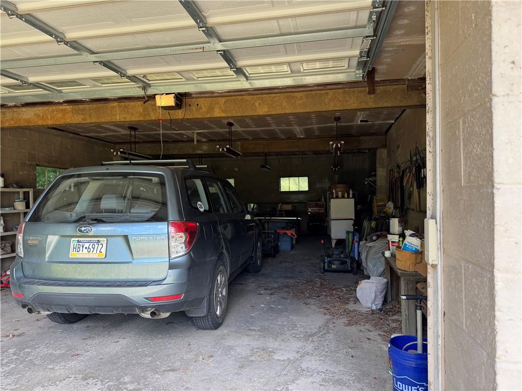 828 Brownhome Road New Castle, PA 16101 - Photo 8 of 47 a view of parking garage with cars