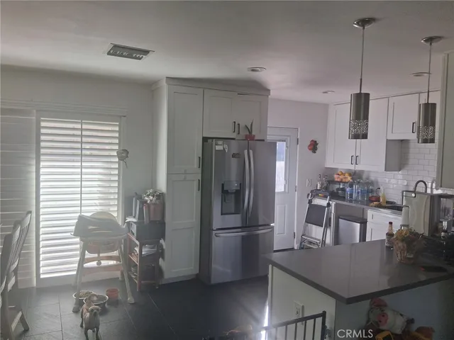 a bathroom with a shower sink and mirror