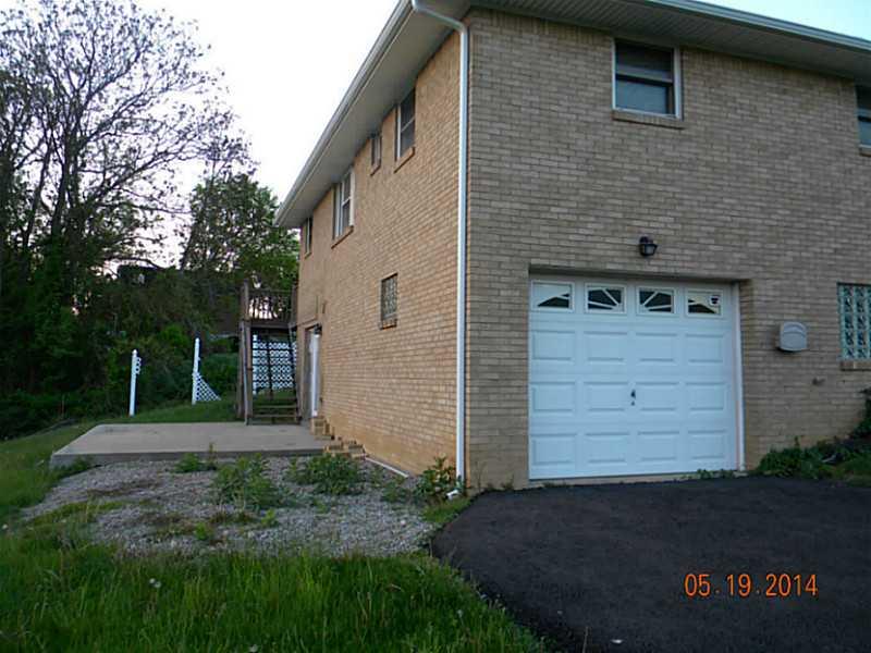 1124 Fells Church Road Belle Vernon, PA 15012 - Photo 3 of 15 Exterior Back. Cement patio and garage.