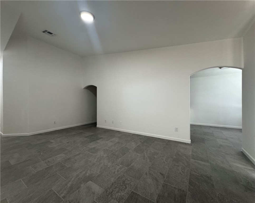 3442 Sunriver Road Bullhead City, AZ 86429 - Photo 2 of 3 Spare room featuring arched walkways and baseboards