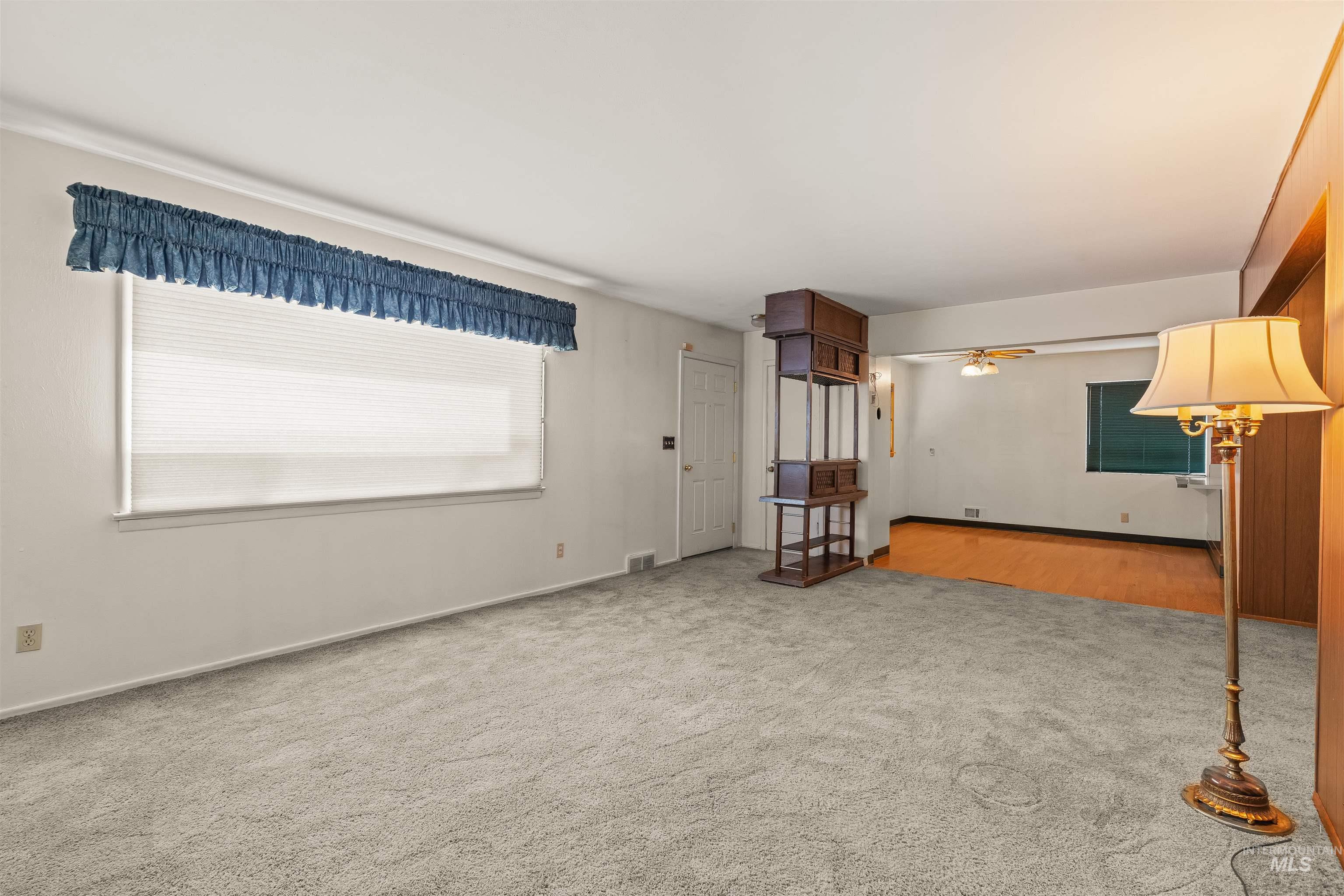 1663 9th Avenue Lewiston, ID 83501 - Photo 31 of 36 Spacious living area featuring light gray carpet flooring and white walls