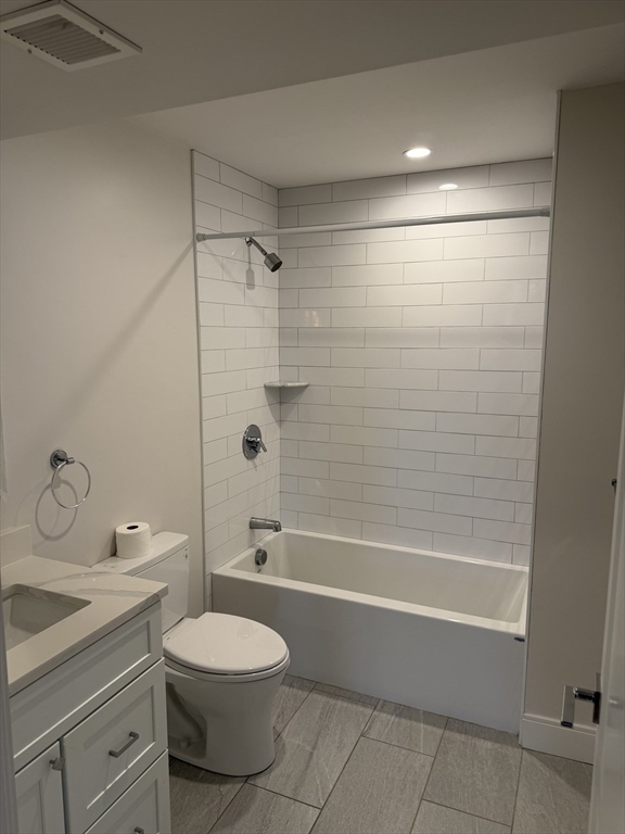 7 Saco Street, Unit 5 Boston, MA 02122 - Photo 6 of 13 a bathroom with a toilet a sink and bathtub