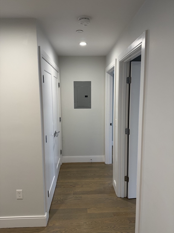 7 Saco Street, Unit 5 Boston, MA 02122 - Photo 8 of 13 a view of a hallway with wooden floor and closet