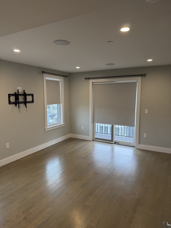 7 Saco Street, Unit 5 Boston, MA 02122 - Photo 10 of 13 an empty room with windows and closet