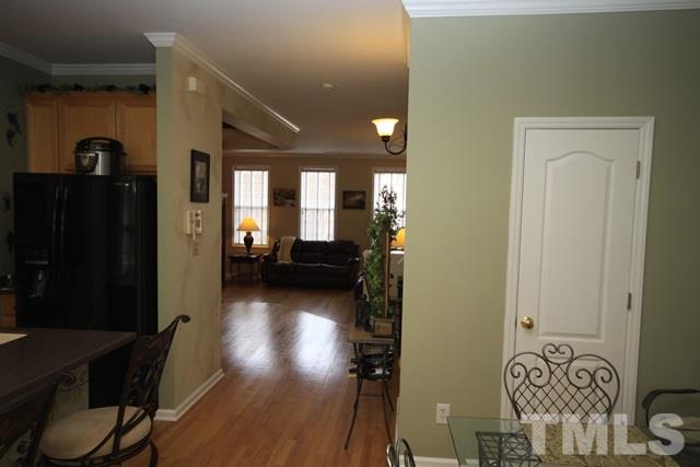 1439 Basinger Court Raleigh, NC 27612 - Photo 12 of 25 a view of hallway with livingroom and furniture