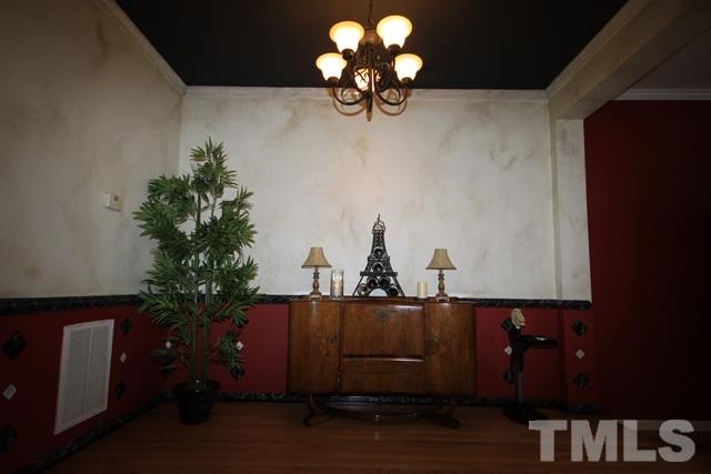 1439 Basinger Court Raleigh, NC 27612 - Photo 14 of 25 a vase of flowers sitting on a table