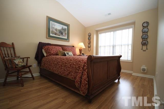 1439 Basinger Court Raleigh, NC 27612 - Photo 21 of 25 a living room with a bed furniture and a window