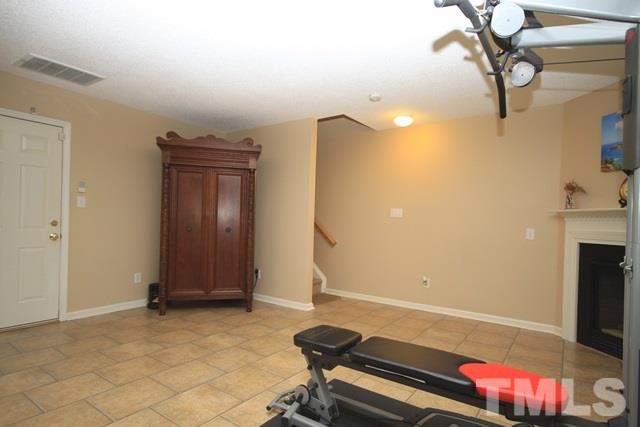 1439 Basinger Court Raleigh, NC 27612 - Photo 23 of 25 a view of a room with gym equipment