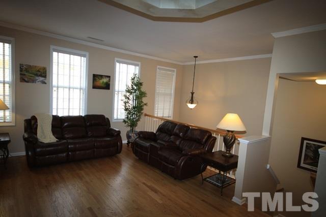1439 Basinger Court Raleigh, NC 27612 - Photo 5 of 25 a living room with furniture and a window