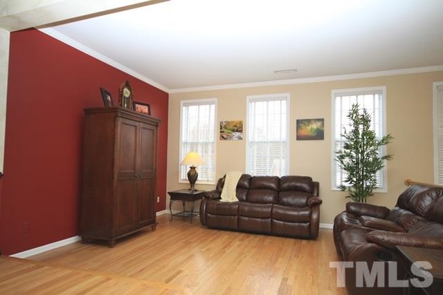 1439 Basinger Court Raleigh, NC 27612 - Photo 6 of 25 a living room with furniture and wooden floor