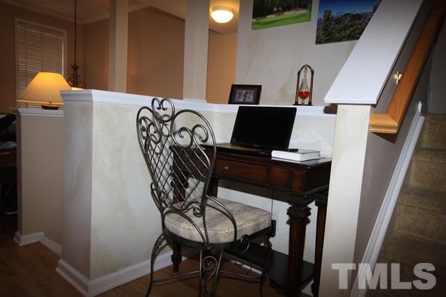 1439 Basinger Court Raleigh, NC 27612 - Photo 7 of 25 a view of a dining room with furniture and chandelier